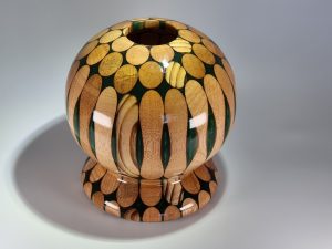 Broom Handles And Green Resin Vase